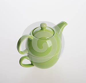 Tea pot set or Porcelain tea pot and cup on background.