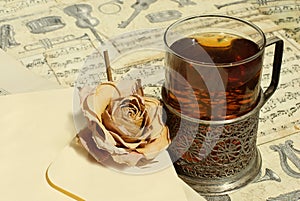 Tea and rose at vintage background