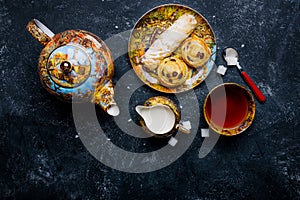 Tea set. Oriental sweets bakery. Top view. Dark background