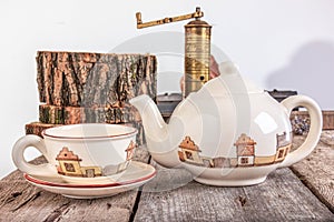 Tea set with teapot on wooden table