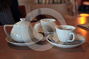 Tea set for two. Ð¡eramic teapot and cups with fragrant hot tea