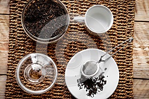 Tea set on the wooden background top view