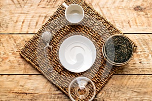 Tea set on the wooden background top view