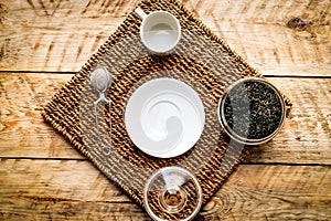 Tea set on the wooden background top view