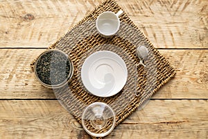 Tea set on the wooden background top view