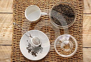 Tea set on the wooden background top view