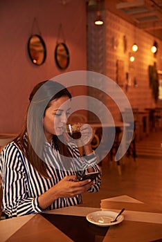 Tea sipping millenial in a restaurant