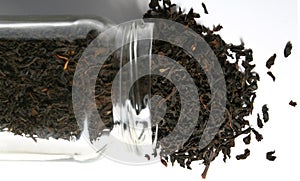 Tea spilling out a glass jar
