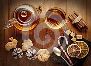 Tea sweet sugar cookies on wooden table (top view)