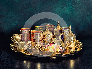 Tea table golden dishes Oriental hospitality Ramadan vintage photo