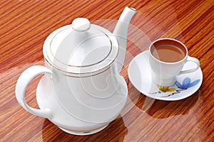 Tea.Tea Milk tea in cup with teapot on wooden background