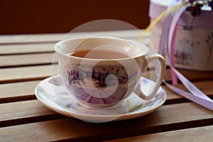 Tea on the terrace, white teacup with purple pattern
