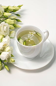 Tea time. Relaxing with herbal tea, white background, top view, vertical