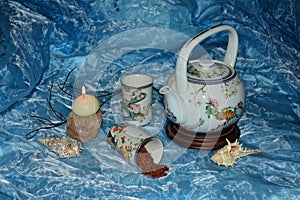 Tea time - teapot, cups , tea and candle