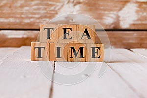 TEA TIME words. Alphabets written on wooden block