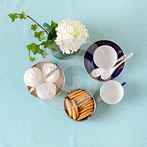 Tea time with zephyr and cookies in vintage bowls.