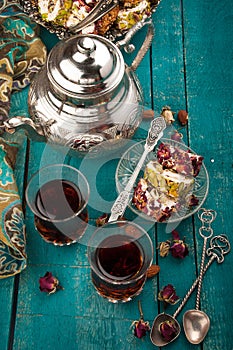 Tea and turkish delight on wooden background