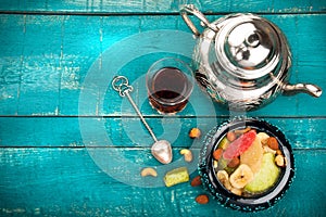 Tea and turkish delight on wooden background