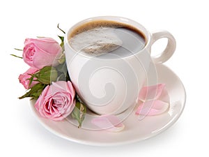 Tea in a white porcelain cup and a bouquet of roses isolated on a white background