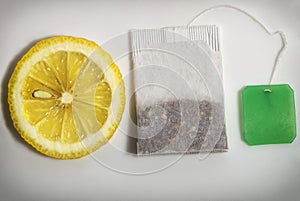 Teabag and slice of lemon of close-up on a white background and ready free space copyspace on the label