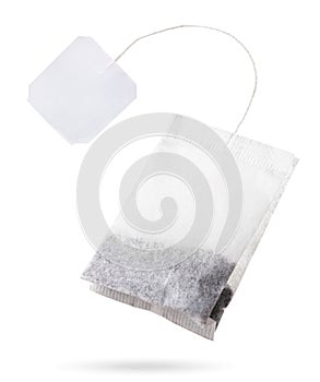 Teabag with white label flies on white background, isolated. Tea bag mockup