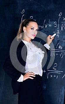 Teacher against a chalkboard