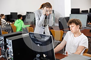 Teacher amazed by misbehavior of teenage boy during computer science lesson