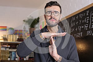 Teacher asking for a break with time-out hand gesture