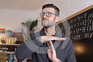 Teacher asking for a break with time-out hand gesture