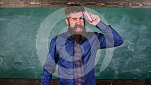Teacher bearded man with pink stapler chalkboard background. Pin it on mind. Teaching memorization techniques. Hipster photo