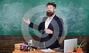 Teacher bearded man tell interesting story. Teacher interesting interlocutor best friend. Talking to students or pupils photo