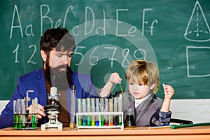 Teacher bearded scientist man child test tubes. Chemical experiment. Genius child private lesson. Knowledge day. Genius