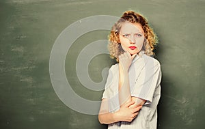 Teacher best friend of learners. Good teacher is master of simplification. Woman teacher in front of chalkboard. Teacher photo