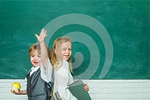 Teacher and child. Back to school. Cute little preschool kid boy with Little child girl in a classroom. Ready for school