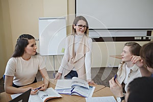 Teacher with college students in class