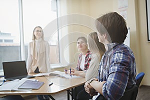 Teacher with college students in class