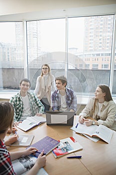 Teacher with college students in class