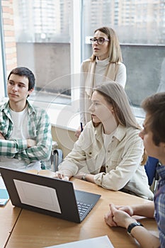 Teacher with college students in class