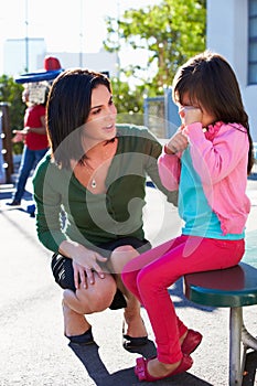 Teacher Comforting Upset Elementary School Pupil