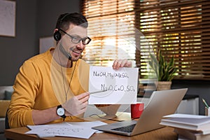 Teacher conducting online lesson at home during COVID-19 quarantine