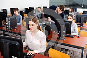 Teacher conducts computer science exam in university class