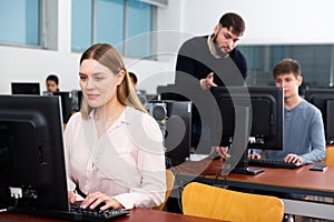 Teacher conducts computer science exam in university class