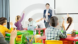 Teacher conducts lesson in elementary school