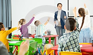 Teacher conducts lesson in elementary school