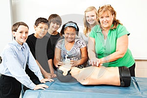 Teacher with CPR Class and Dummy