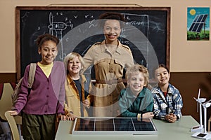 Teacher with Diverse Group of Children Smiling at Camera