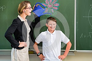 Teacher or docent motivate student or pupil or boy in front of a