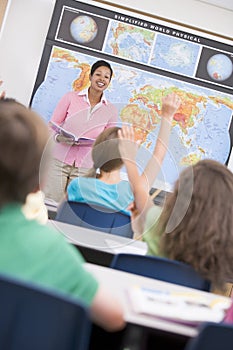 Teacher in elementary school geography class