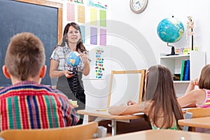 Teacher explaining about Earth globe