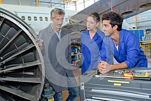 Teacher explaining equipment to trainees